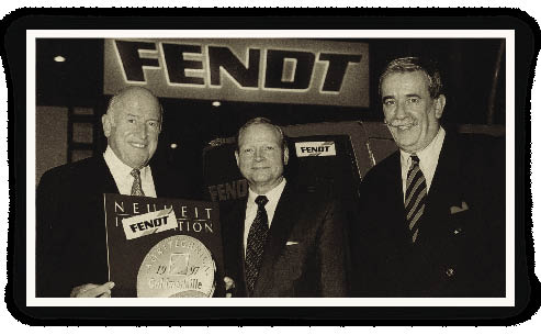 In 1997, AGCO added German tractor Fendt to its growing list of farm equipment brand names. Bob Ratliff, Georg Bickeleiter and Hermann Merschrot (l-r) of Fendt display the gold medal awarded to Fendt for its Vario transmission. 