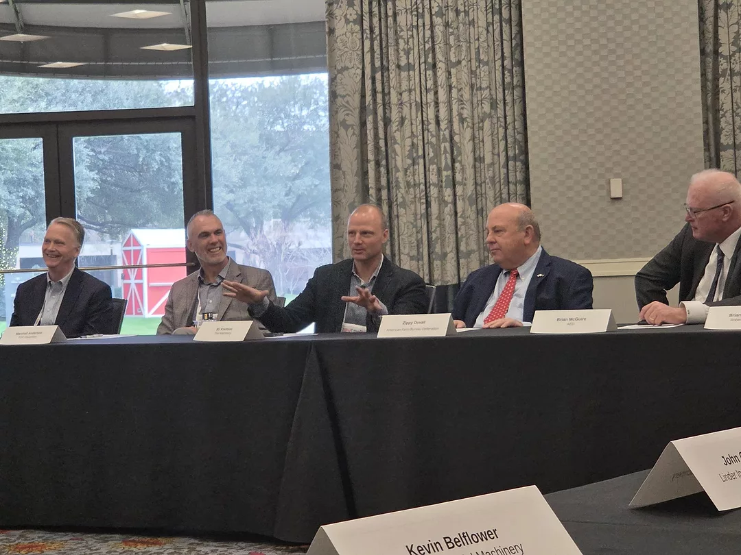 Titan Machinery's BJ Knutson moderates a panel on policy during the AED Summit.