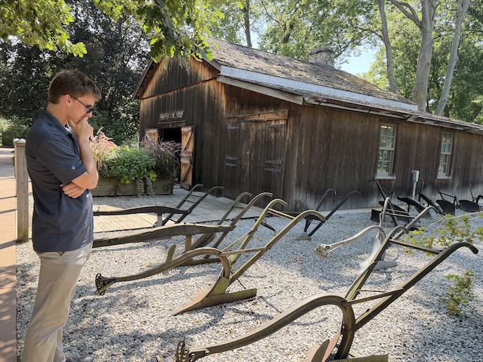 Deere's famous self-scouring steel plows outside of the replica forge