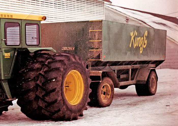 1967-Kinze-first-auger-unloading-grain-wagon.jpg